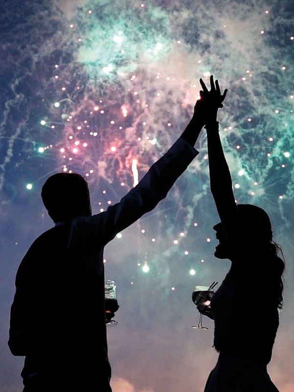 Wedding couple watch a Sonic Fireworks display